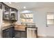 Well-lit kitchen features a copper sink, granite countertops, and stainless steel appliances at 51 S Eaton St, Lakewood, CO 80226