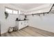 Functional laundry room with ample storage cabinets, counter space, and natural light at 51 S Eaton St, Lakewood, CO 80226