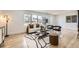 Bright living room featuring hardwood floors, a large window, stylish furniture, and modern decor at 51 S Eaton St, Lakewood, CO 80226