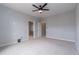 Comfortable bedroom with neutral walls, carpeted floors, a ceiling fan, and closet access at 15443 W 65Th Ave # B, Arvada, CO 80007