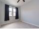 Bright bedroom with neutral walls, carpeted floors, and natural light from the large windows at 15443 W 65Th Ave # B, Arvada, CO 80007