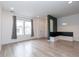 Inviting living area featuring large windows, wood-look floors, and a cozy, built-in bench at 15443 W 65Th Ave # B, Arvada, CO 80007