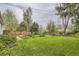 This backyard is spacious with lush grass and a wooden fence around the perimeter at 5370 S Sherman St, Littleton, CO 80121