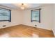 Bright bedroom with hardwood floors and two large windows at 5370 S Sherman St, Littleton, CO 80121