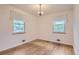 Bedroom with hardwood floors and bright windows at 5370 S Sherman St, Littleton, CO 80121