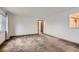 Bright living room featuring neutral carpet, white walls, and a large window for plenty of natural light at 5370 S Sherman St, Littleton, CO 80121