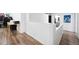 Bright hallway with hardwood floors leading to an office and an open space at 20765 E 39Th Ave, Denver, CO 80249