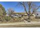 Ranch style home with mature tree and landscaping at 4030 S Hazel Ct, Englewood, CO 80110