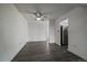 Living room includes wood flooring and stainless steel refrigerator at 4569 S Lowell Blvd # B, Denver, CO 80236
