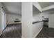 Open-concept living room with hard surface floors, white walls, and natural light at 4569 S Lowell Blvd # B, Denver, CO 80236
