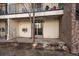 View of patio area with sliding glass door and exterior storage at 4569 S Lowell Blvd # B, Denver, CO 80236