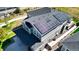 House with solar panels on the roof, backyard, and driveway at 26994 E Indore Ave, Aurora, CO 80016