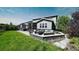 Landscaped backyard with patio and fire pit at 26994 E Indore Ave, Aurora, CO 80016