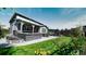 Landscaped backyard with patio and outdoor kitchen at 26994 E Indore Ave, Aurora, CO 80016