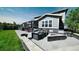 Spacious backyard patio with fire pit and seating area at 26994 E Indore Ave, Aurora, CO 80016