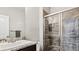 Clean bathroom with a walk-in shower and granite vanity at 26994 E Indore Ave, Aurora, CO 80016