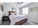 Bright bedroom with a ceiling fan and large window at 26994 E Indore Ave, Aurora, CO 80016