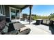 Relaxing covered patio with comfortable seating and outdoor kitchen at 26994 E Indore Ave, Aurora, CO 80016