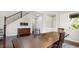 Formal dining room featuring a large wooden table and hardwood floors at 26994 E Indore Ave, Aurora, CO 80016