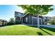 Two-story home with gray siding, stone accents, and a two-car garage at 26994 E Indore Ave, Aurora, CO 80016