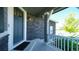 Front entrance with dark gray door and stone accents at 26994 E Indore Ave, Aurora, CO 80016