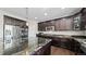 Gourmet kitchen with granite island and stainless steel appliances at 26994 E Indore Ave, Aurora, CO 80016
