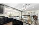 Open kitchen with a large island that overlooks the Gathering room at 26994 E Indore Ave, Aurora, CO 80016