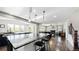 Open kitchen with large island, granite countertops, and stainless steel appliances at 26994 E Indore Ave, Aurora, CO 80016