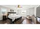 Large main bedroom with hardwood floor and sitting area at 26994 E Indore Ave, Aurora, CO 80016