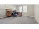 Bright home office with window and wood desk at 26994 E Indore Ave, Aurora, CO 80016