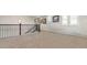 Spacious upstairs hallway with window and carpet at 26994 E Indore Ave, Aurora, CO 80016