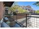 A relaxing balcony with outdoor seating and metal railings, perfect for enjoying scenic community views at 10184 Park Meadows Dr # 1102, Lone Tree, CO 80124