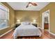 A comfortable bedroom featuring two windows with great natural light and a ceiling fan at 10184 Park Meadows Dr # 1102, Lone Tree, CO 80124