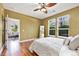 Bright bedroom with hardwood floors, plush bed, and windows that invite the outdoors in at 10184 Park Meadows Dr # 1102, Lone Tree, CO 80124