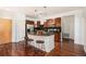 Well-appointed kitchen with granite island, stainless appliances, and breakfast bar at 10184 Park Meadows Dr # 1102, Lone Tree, CO 80124