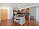 Charming kitchen with granite island, stainless appliances, and breakfast bar seating at 10184 Park Meadows Dr # 1102, Lone Tree, CO 80124