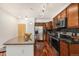 Charming kitchen with granite-topped island and seating, plus modern stainless appliances and custom cabinets at 10184 Park Meadows Dr # 1102, Lone Tree, CO 80124