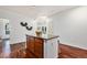 Kitchen with granite island and seating, stainless steel appliances and warm wood cabinetry at 10184 Park Meadows Dr # 1102, Lone Tree, CO 80124