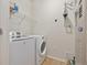 This functional laundry room offers modern appliances and ample space for laundry tasks at 10184 Park Meadows Dr # 1102, Lone Tree, CO 80124
