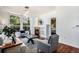 Bright living room with a fireplace, hardwood floors, and large windows at 10184 Park Meadows Dr # 1102, Lone Tree, CO 80124