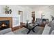 Living room featuring a fireplace, hardwood floors, and dining area at 10184 Park Meadows Dr # 1102, Lone Tree, CO 80124