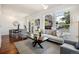 Bright living room with hardwood floors, comfortable seating, and views from the balcony at 10184 Park Meadows Dr # 1102, Lone Tree, CO 80124