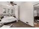 Comfortable bedroom with a ceiling fan and natural light from multiple windows at 2664 Dahlia St, Denver, CO 80207