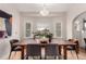 Bright dining room featuring a wooden table, modern chairs and natural light at 2664 Dahlia St, Denver, CO 80207