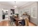 Inviting dining room features hardwood floors, large windows, and stylish furniture at 2664 Dahlia St, Denver, CO 80207