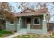 Charming single story home featuring a cozy front porch and walkway at 2664 Dahlia St, Denver, CO 80207