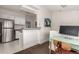 Home office adjacent to kitchen with lots of natural light at 2664 Dahlia St, Denver, CO 80207