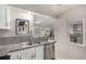 Well-lit kitchen offers stainless steel appliances and granite countertops at 2664 Dahlia St, Denver, CO 80207