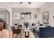 Inviting living room with large windows, a fireplace and comfortable seating at 2664 Dahlia St, Denver, CO 80207