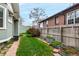 Spacious yard featuring lush grass and privacy fence at 2664 Dahlia St, Denver, CO 80207